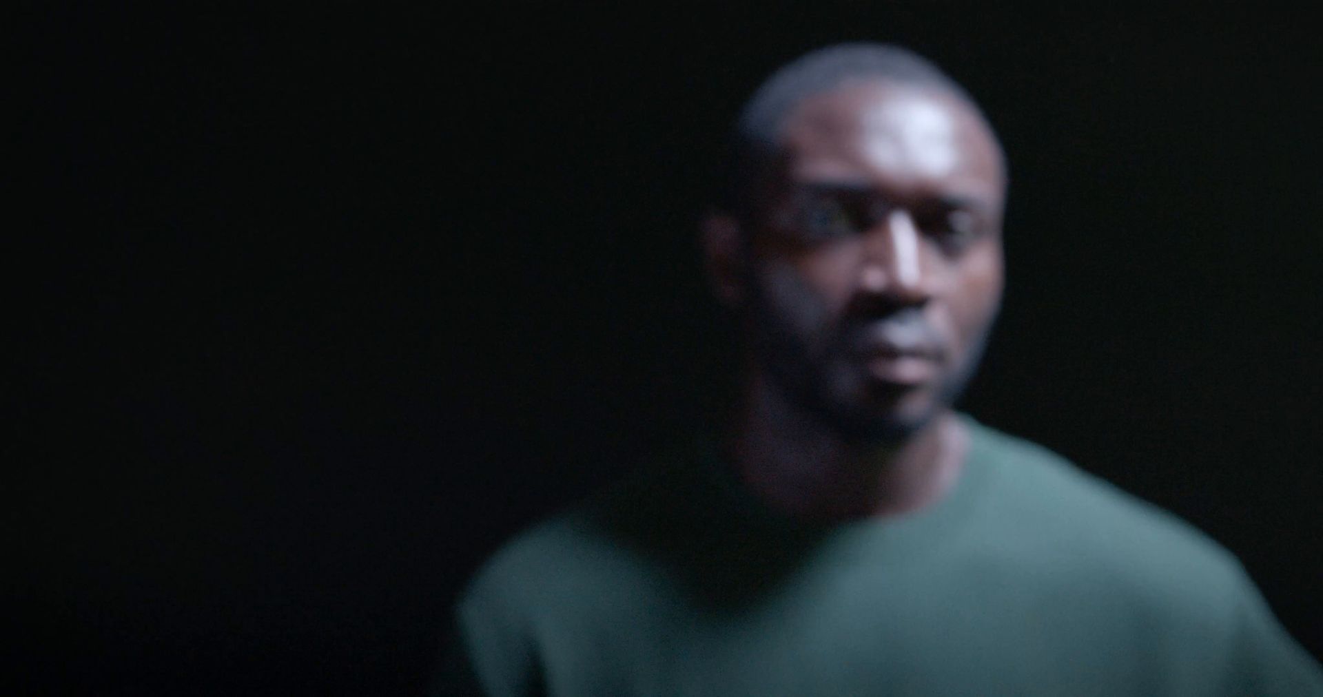 Portrait of a man against a dark background