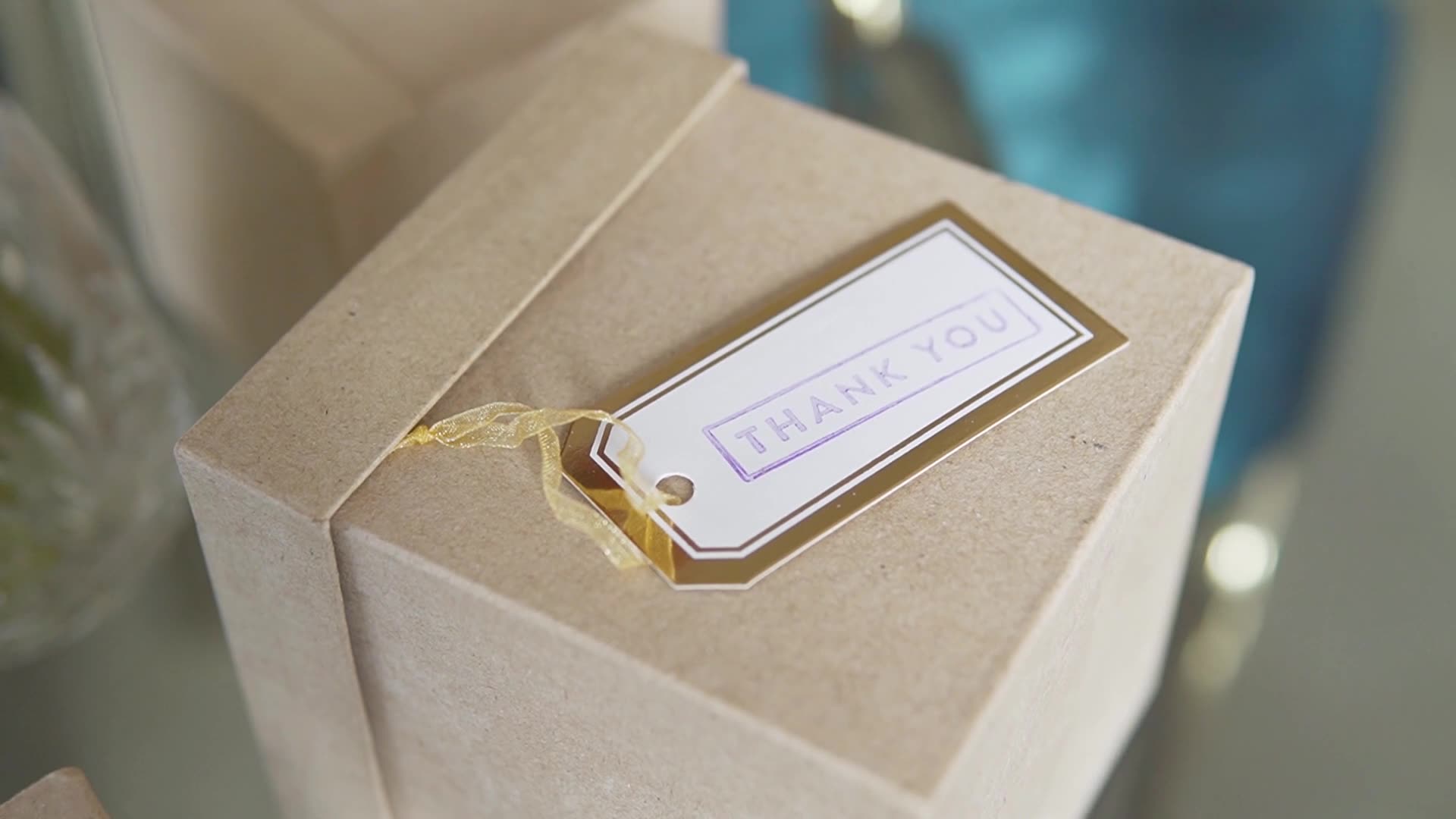 A gift box with a thank-you tag