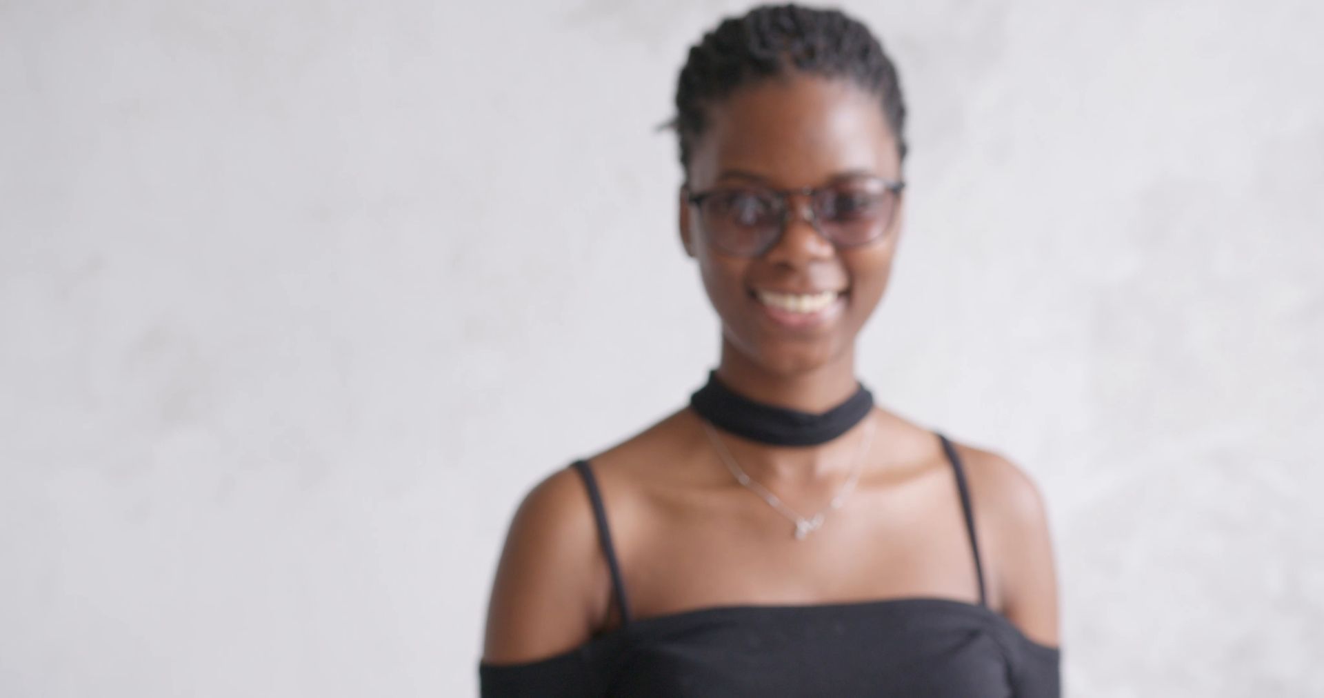 A woman smiling in a photo studio